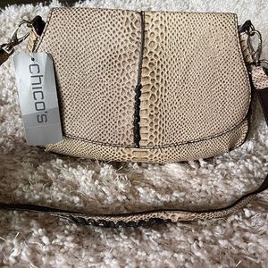 Chico’s snakeskin, embossed bag with purple satin interior